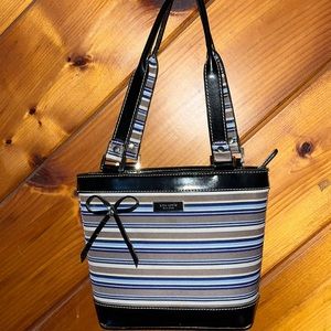 Kate Spade medium sized purse. Multi-colored with black, blue, brown and cream.